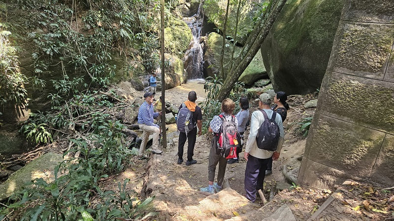 group of people admiring a awterfall