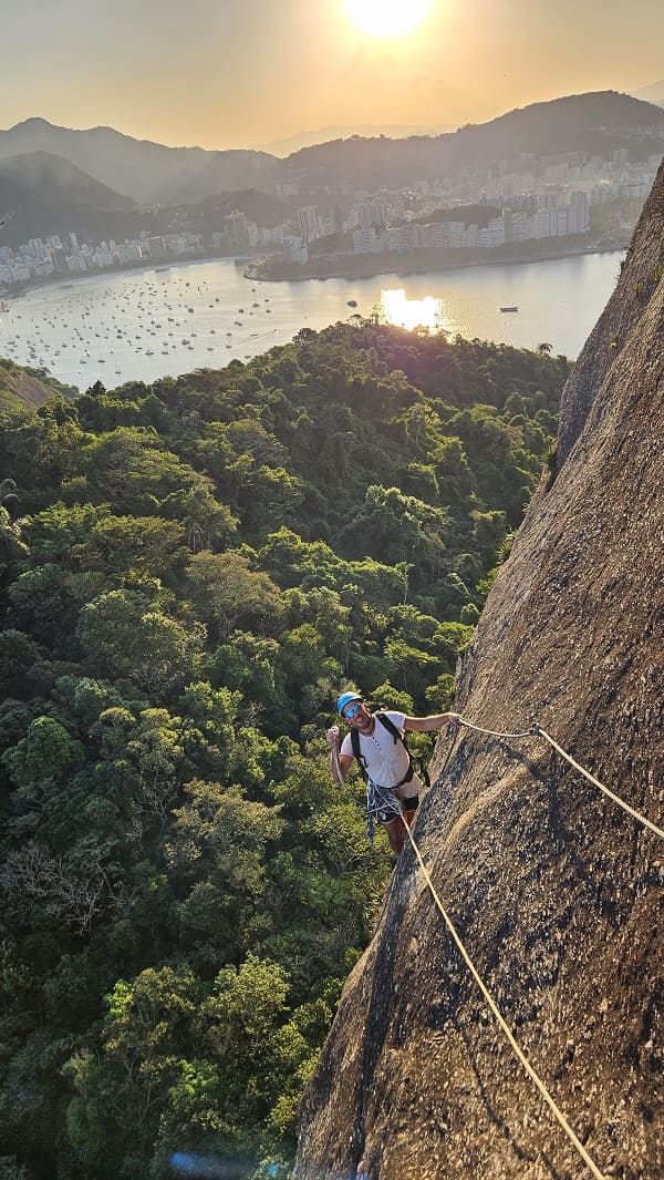 man climbing via ferrata on Sugarloag mountain in Rio de Janeiro