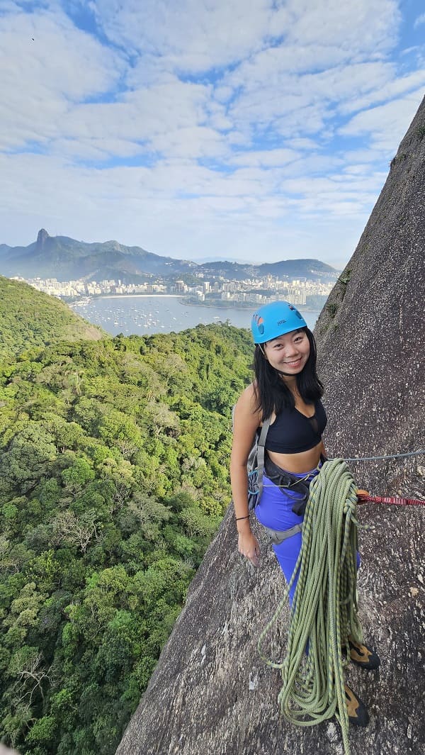 woman climbing via ferrata on Sugarloag mountain in Rio de Janeiro